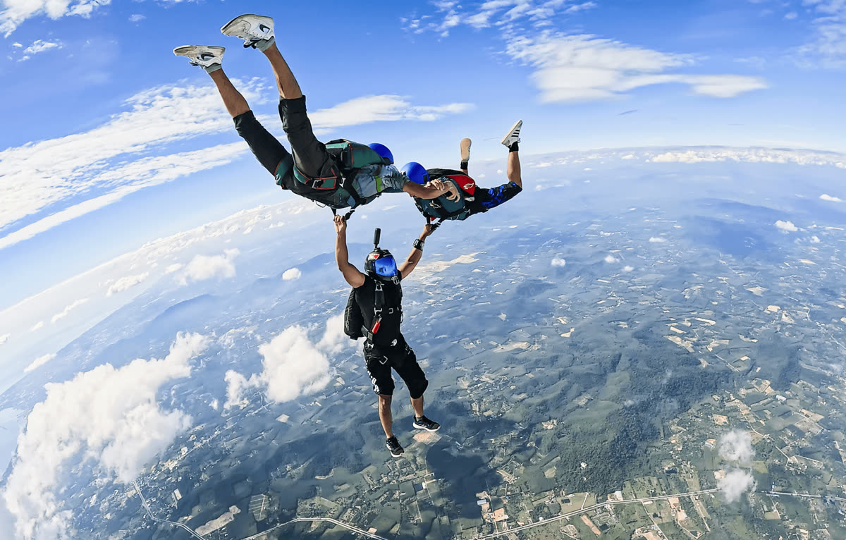 Licensed skydivers in formation during freefall